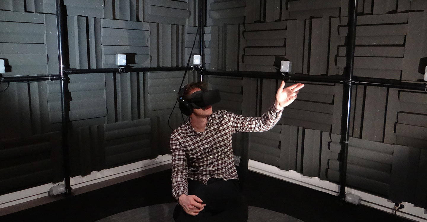 Person inside of sound room with vr headset on